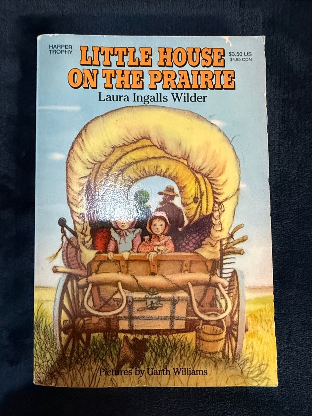 Little House on the Prairie by Laura Ingalls Wilder — Yellow & Blue Paperback